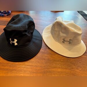 Under Armour bucket hats. White and black. Size medium. Children’s
